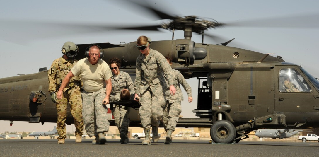 military medical personnel and chopper