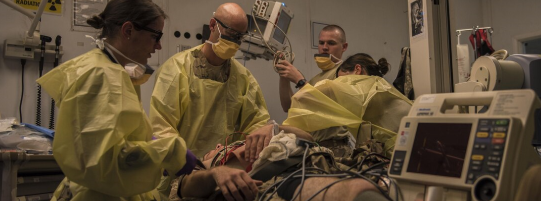 military drs in Operating Room w/ patient